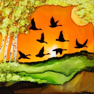Alcohol ink artwork of birds flying in a sunset by Betty Sawatzky